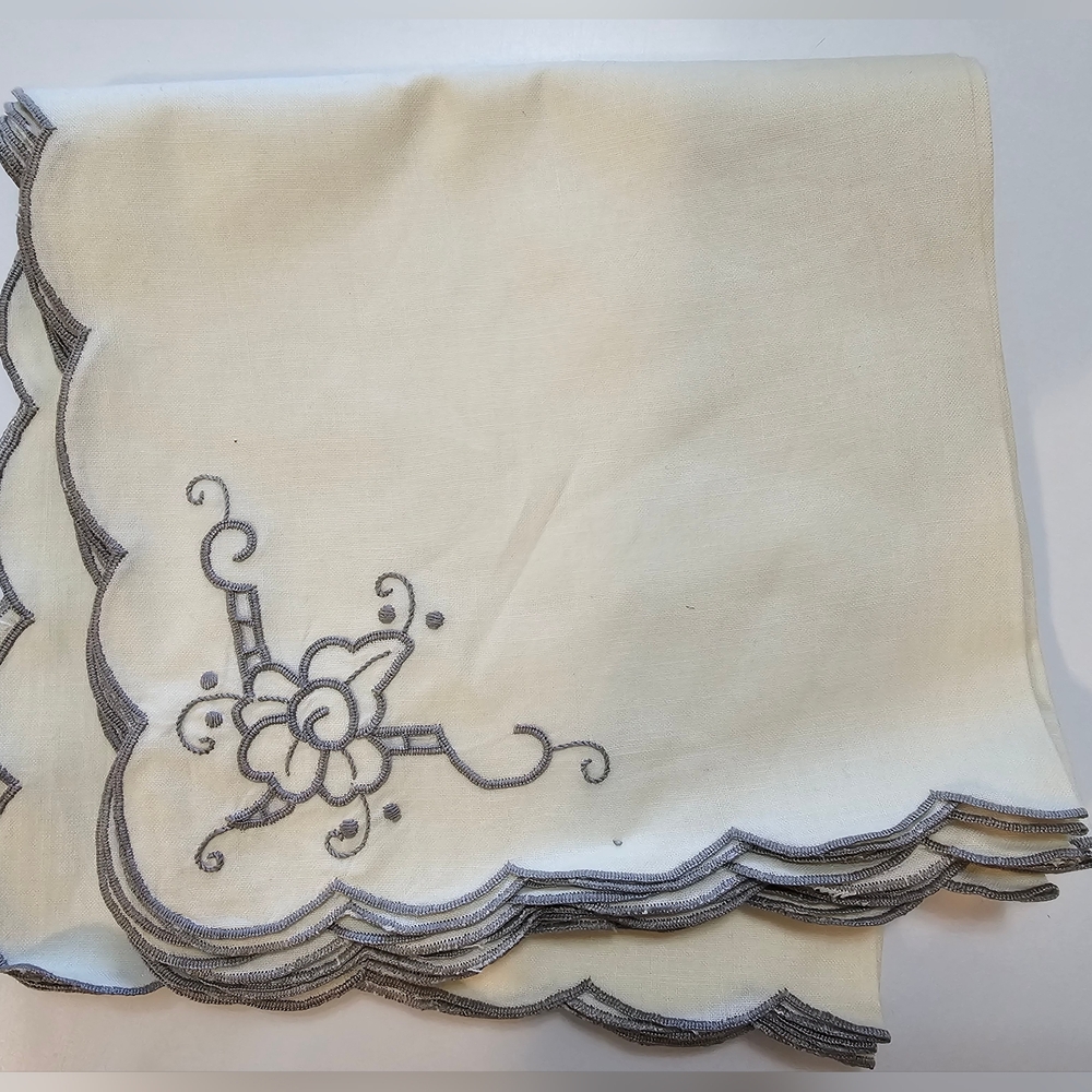 A Set of 8 Madeira Hand Embroidered Pale YellowEcru Cloth Napkins with Scalloped